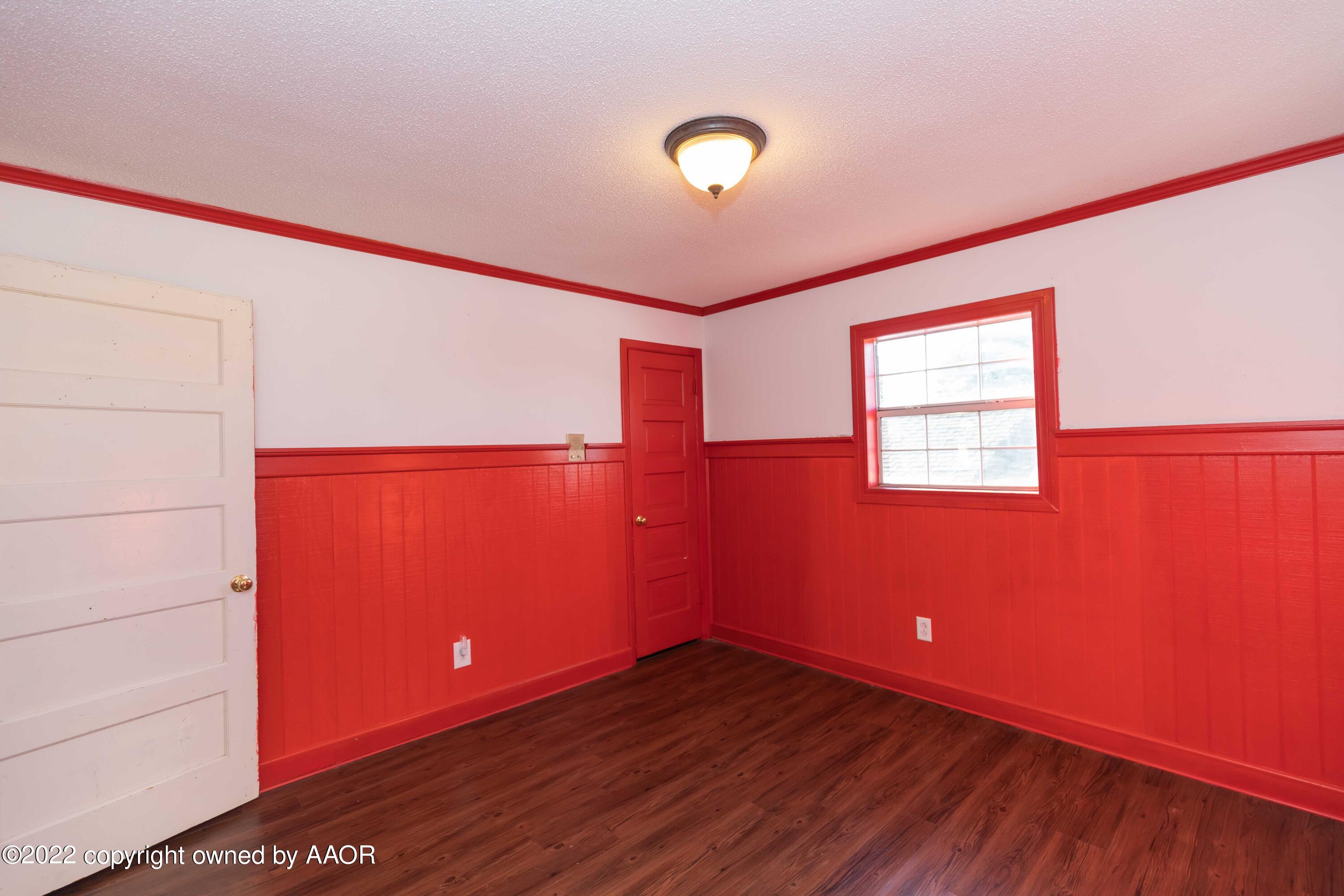 1302 Potter Street Borger, TX 79007 - Photo 41 of 53 a view of empty room with wooden floor