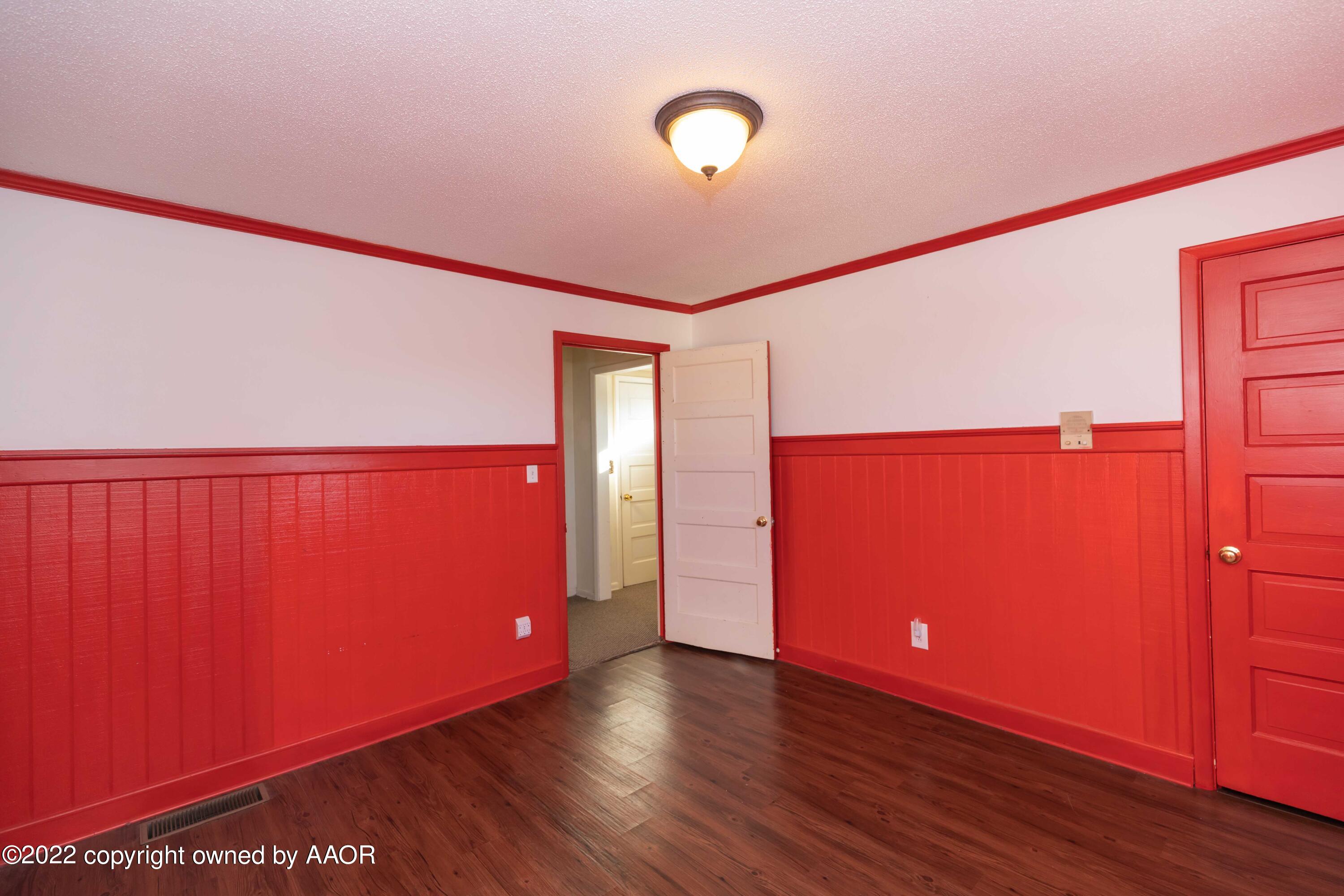 1302 Potter Street Borger, TX 79007 - Photo 42 of 53 a view of an empty room with wooden floor