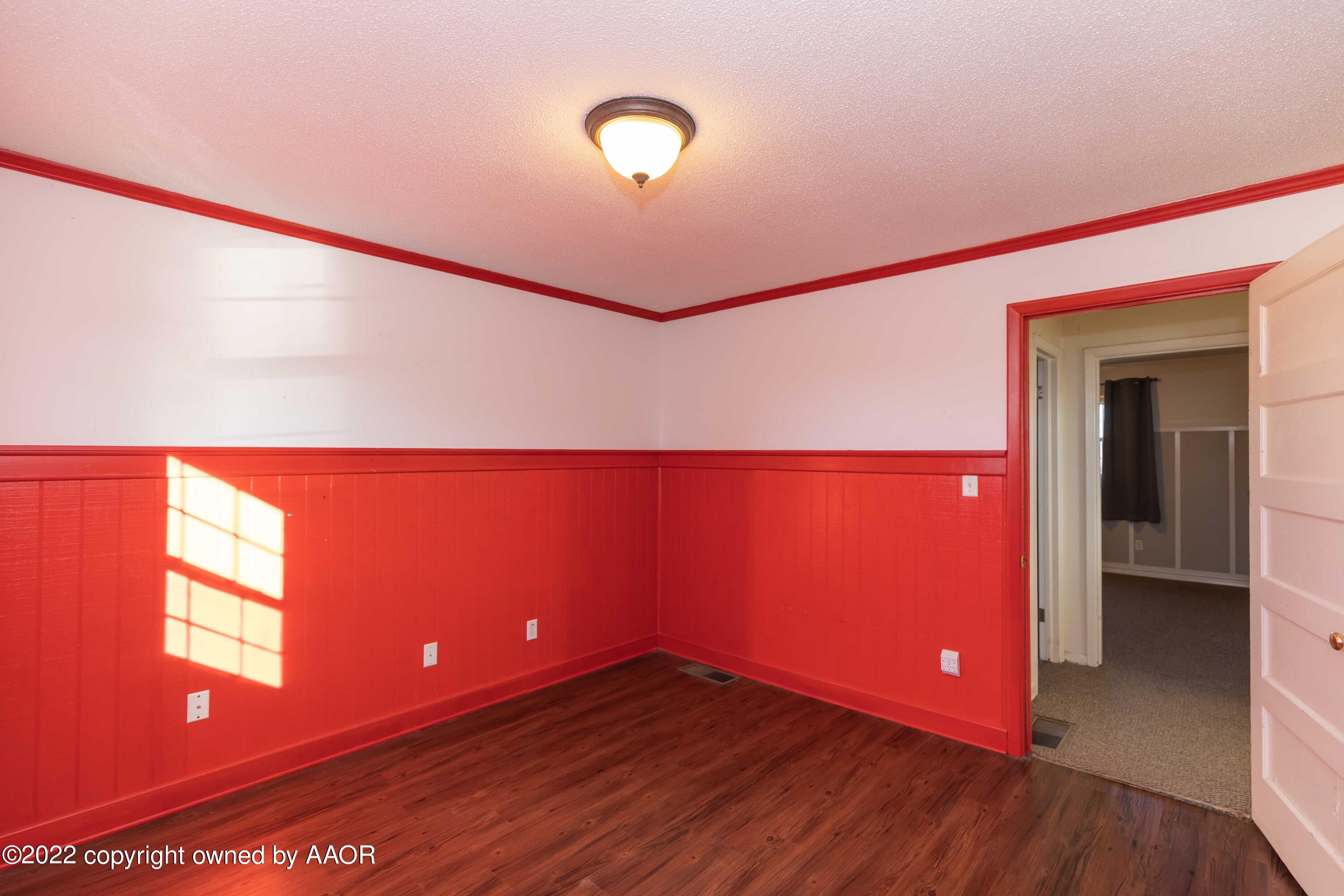 1302 Potter Street Borger, TX 79007 - Photo 43 of 53 a view of an empty room with wooden floor