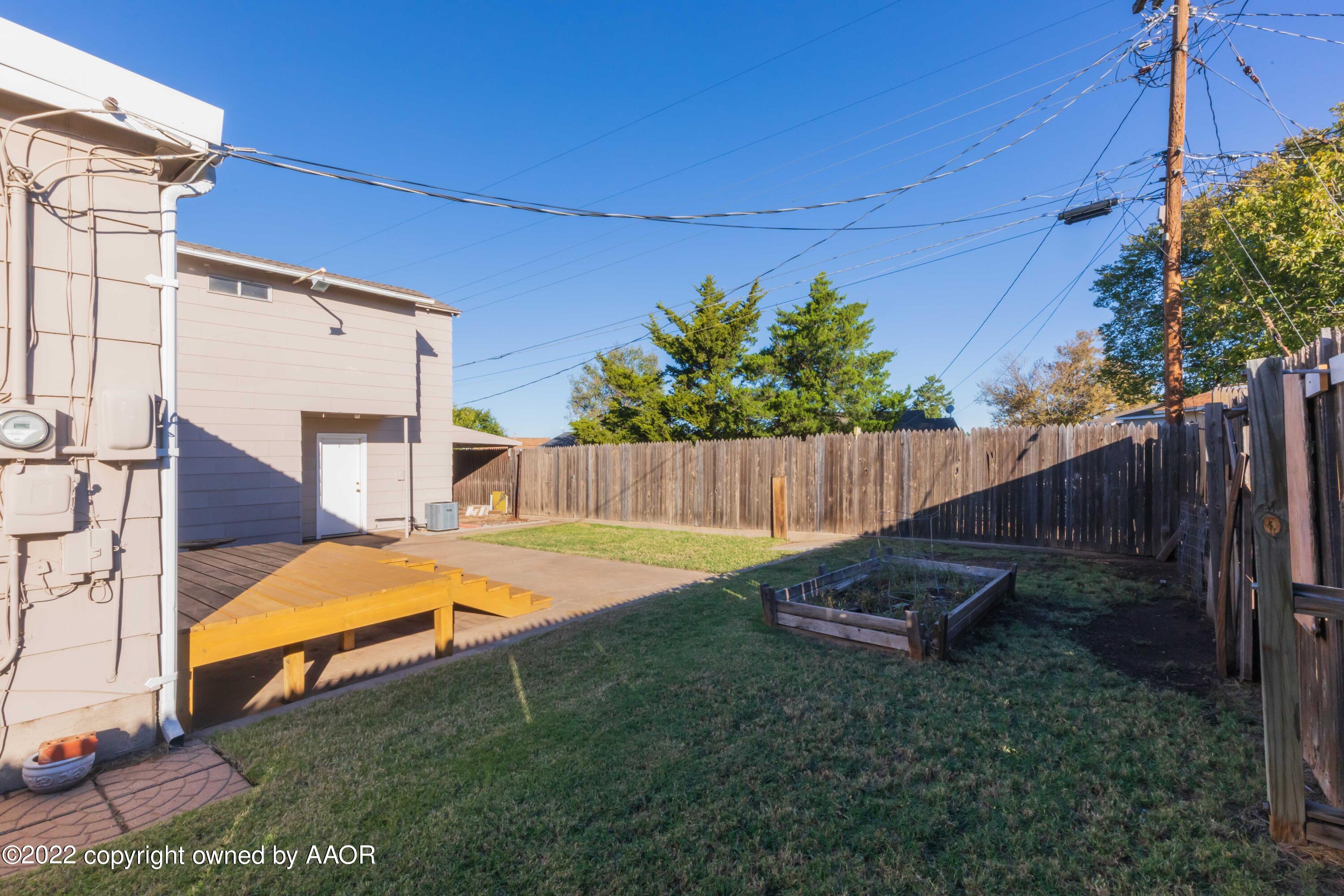 1302 Potter Street Borger, TX 79007 - Photo 53 of 53 a view of a backyard with a wooden fence