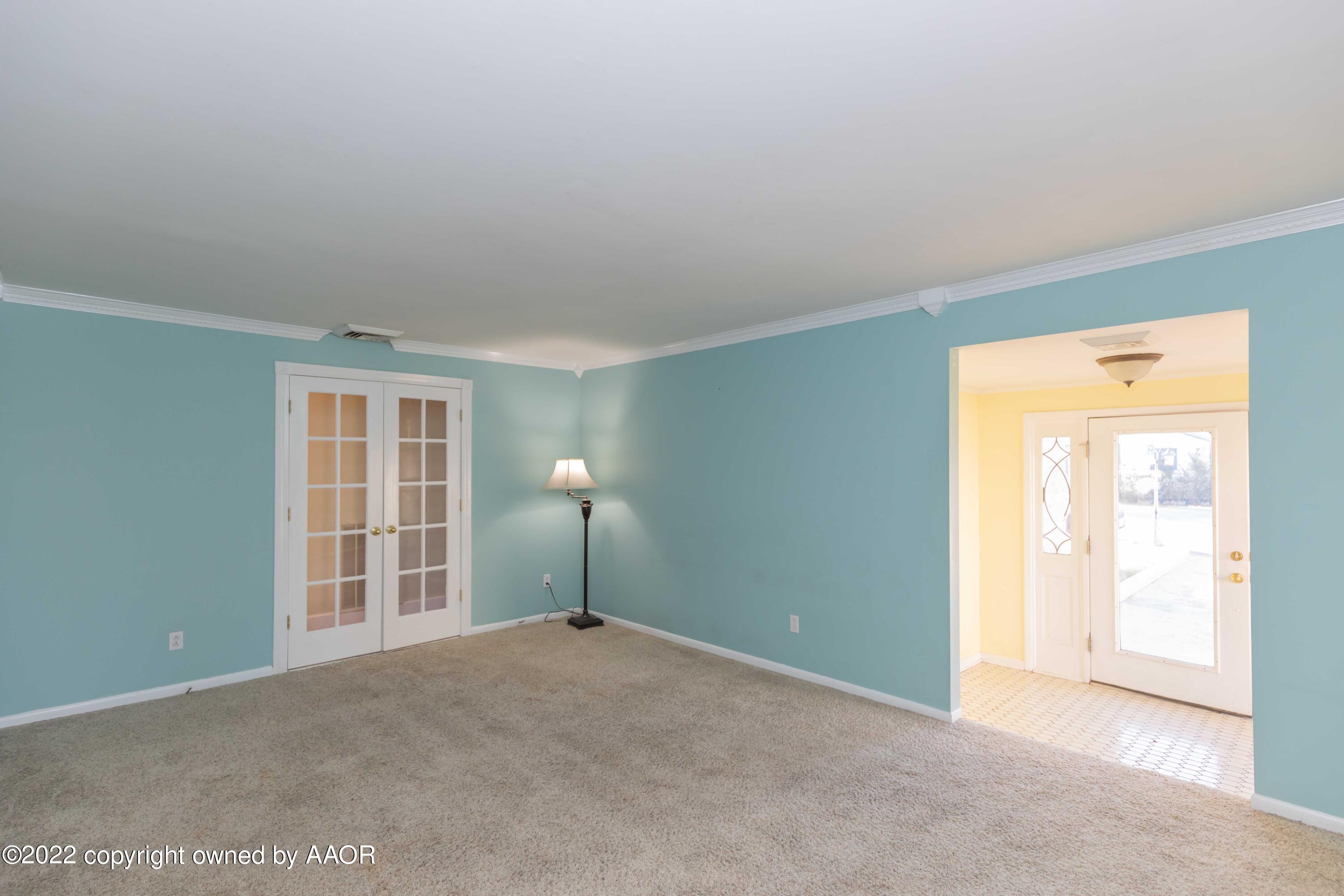 1302 Potter Street Borger, TX 79007 - Photo 6 of 53 a view of an empty room with a window
