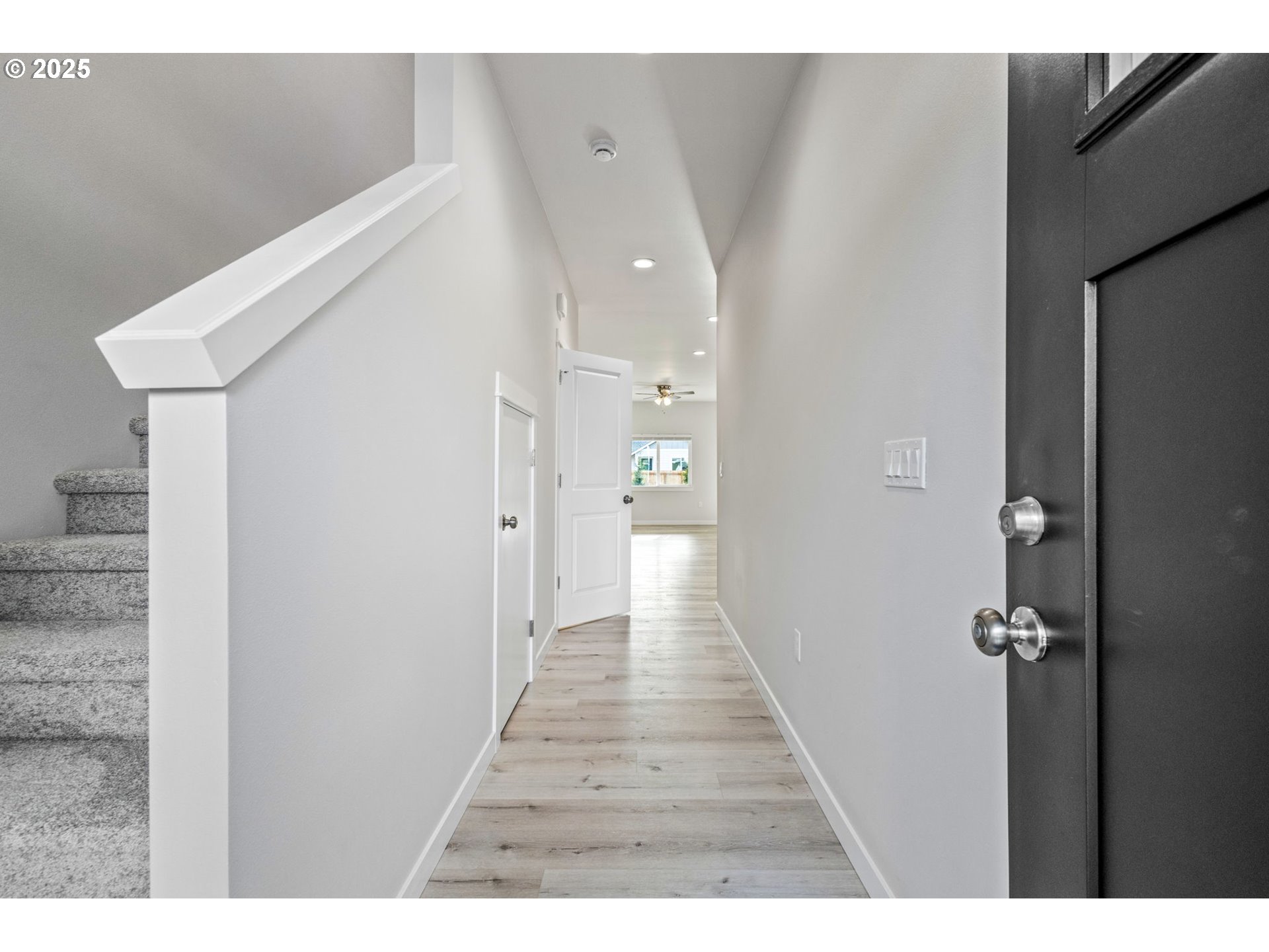 3619 Green River Road Sweet Home, OR 97386 - Photo 34 of 38 a hallway with wooden floor windows and stairs
