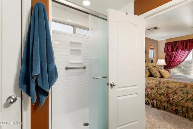 a bathroom with a shower and a tub