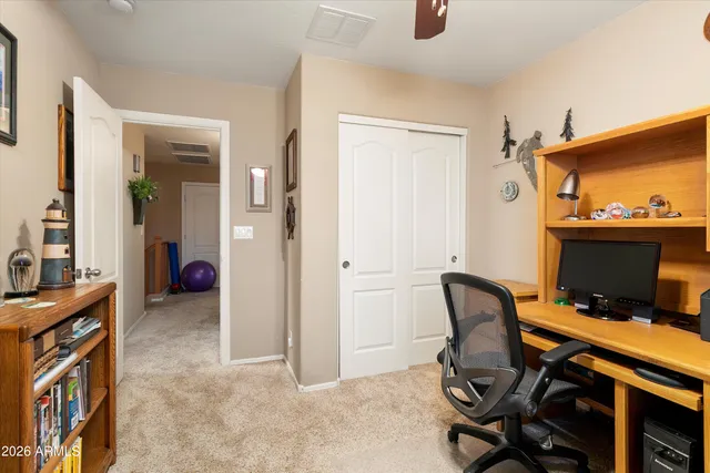 a workspace with furniture and window