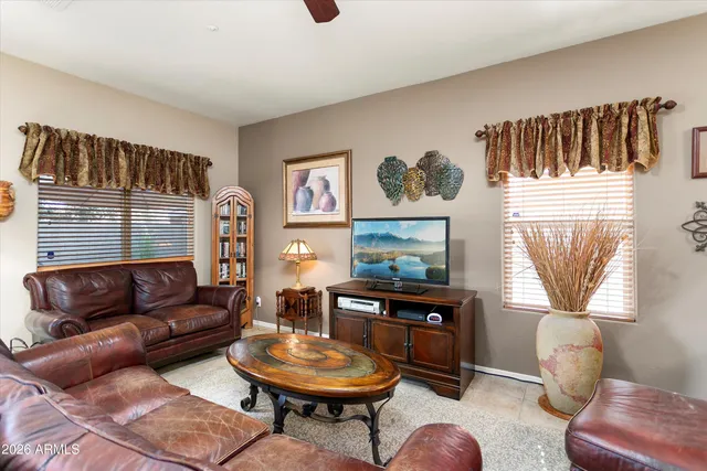 a living room with furniture and a window