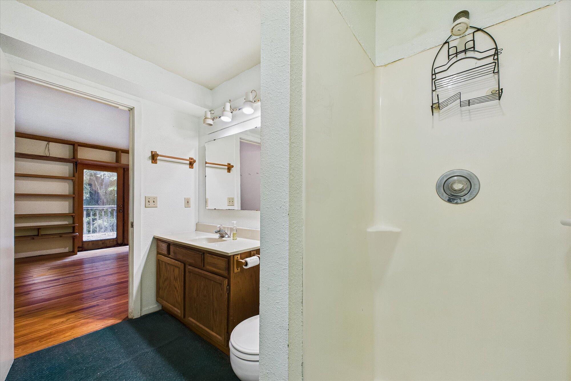 119 Sylva Street Arcata, CA 95521 - Photo 21 of 35 a bathroom with a granite countertop sink toilet and shower