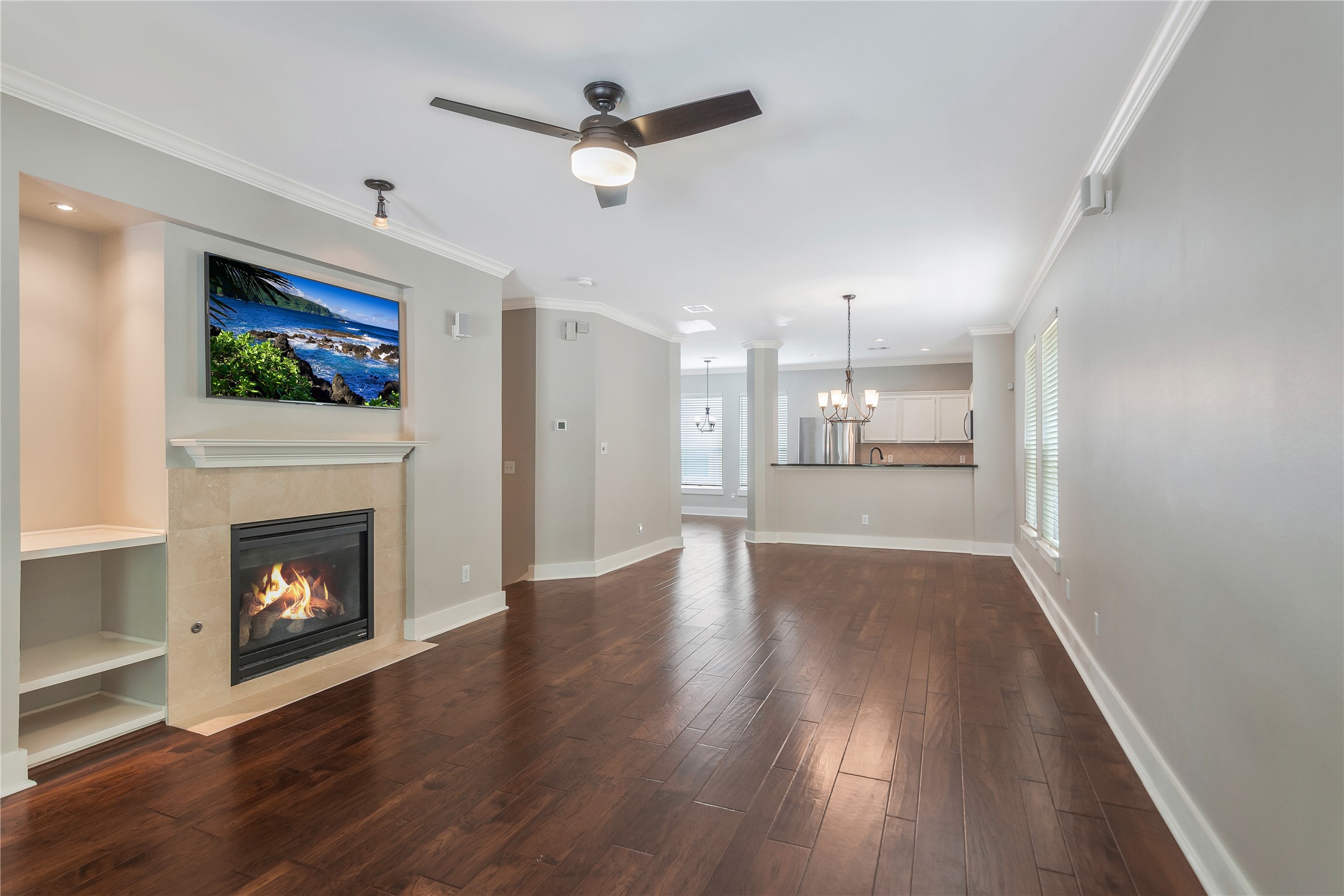 1207 Nagle Street Houston, TX 77003 - Photo 11 of 26 This reverse view shows off the open-plan living space and how it seamlessly connects to a modern kitchen complemented by ample natural light.