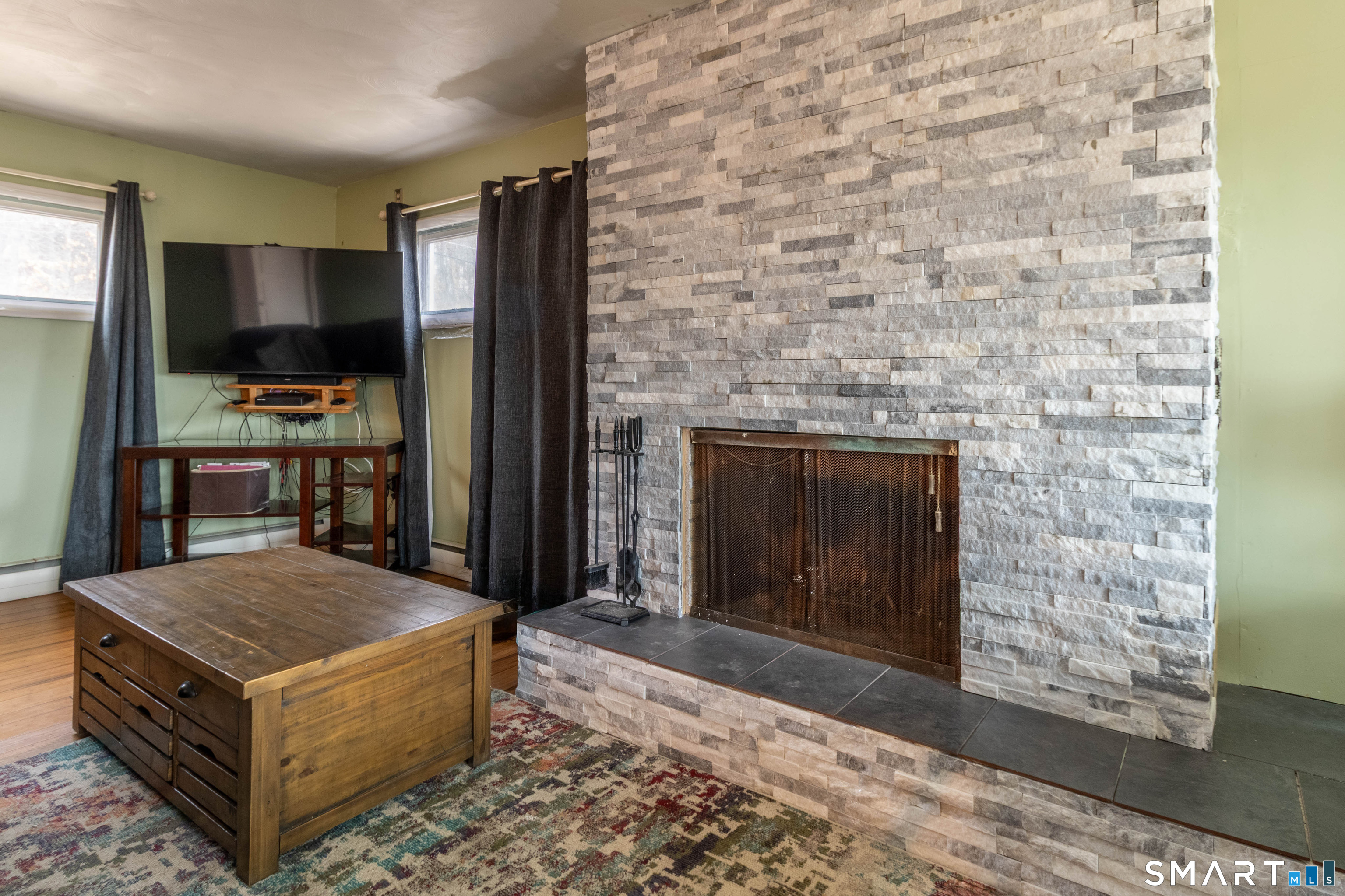 40 Sanitarium Road Windham, CT 06226 - Photo 12 of 33 a living room with furniture and a fireplace