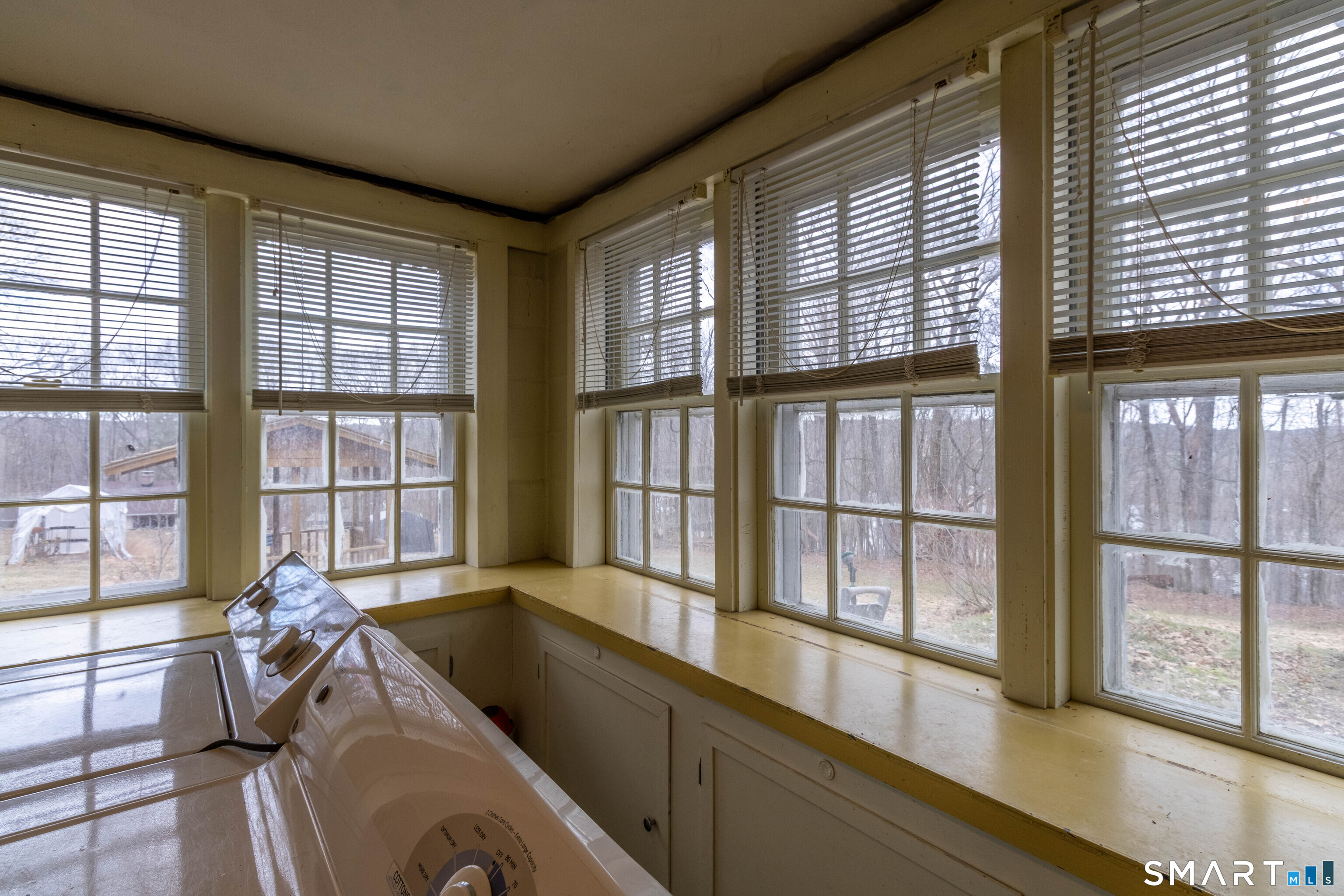 40 Sanitarium Road Windham, CT 06226 - Photo 28 of 33 a living room filled with furniture and windows