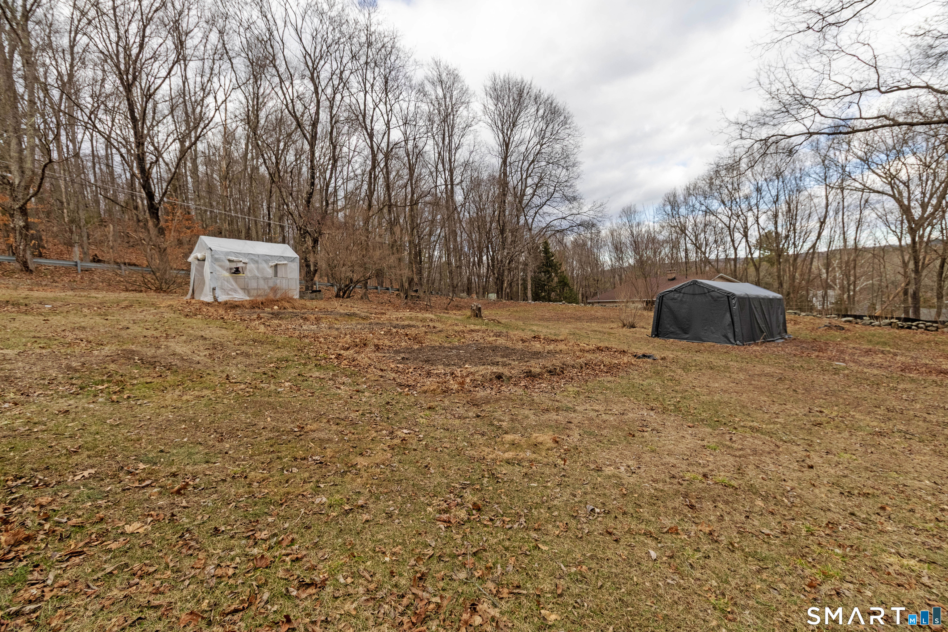 40 Sanitarium Road Windham, CT 06226 - Photo 7 of 33 a street view with large trees