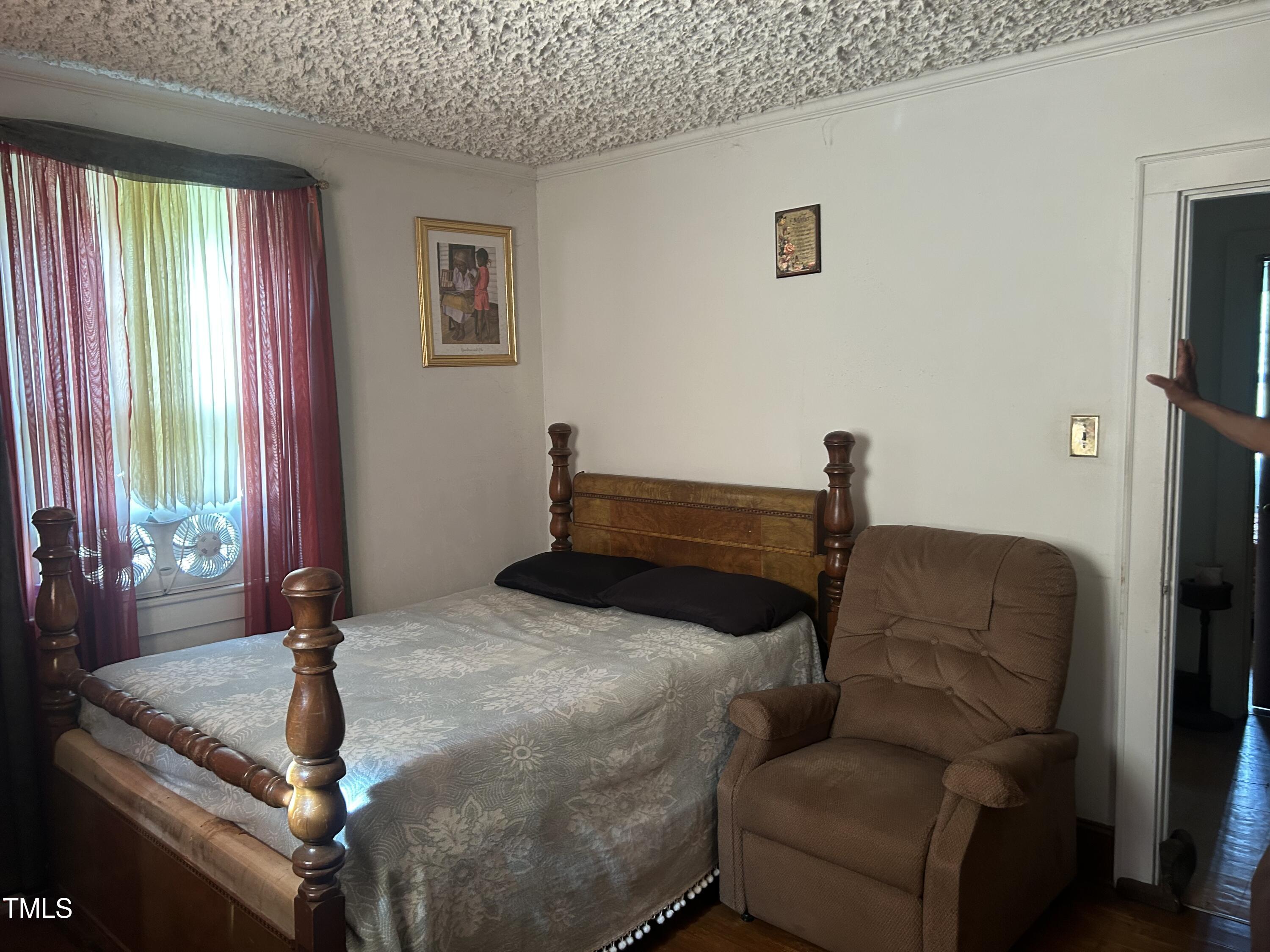 45 Perkinson Street Kittrell, NC 27544 - Photo 5 of 18 a bedroom with bed and window