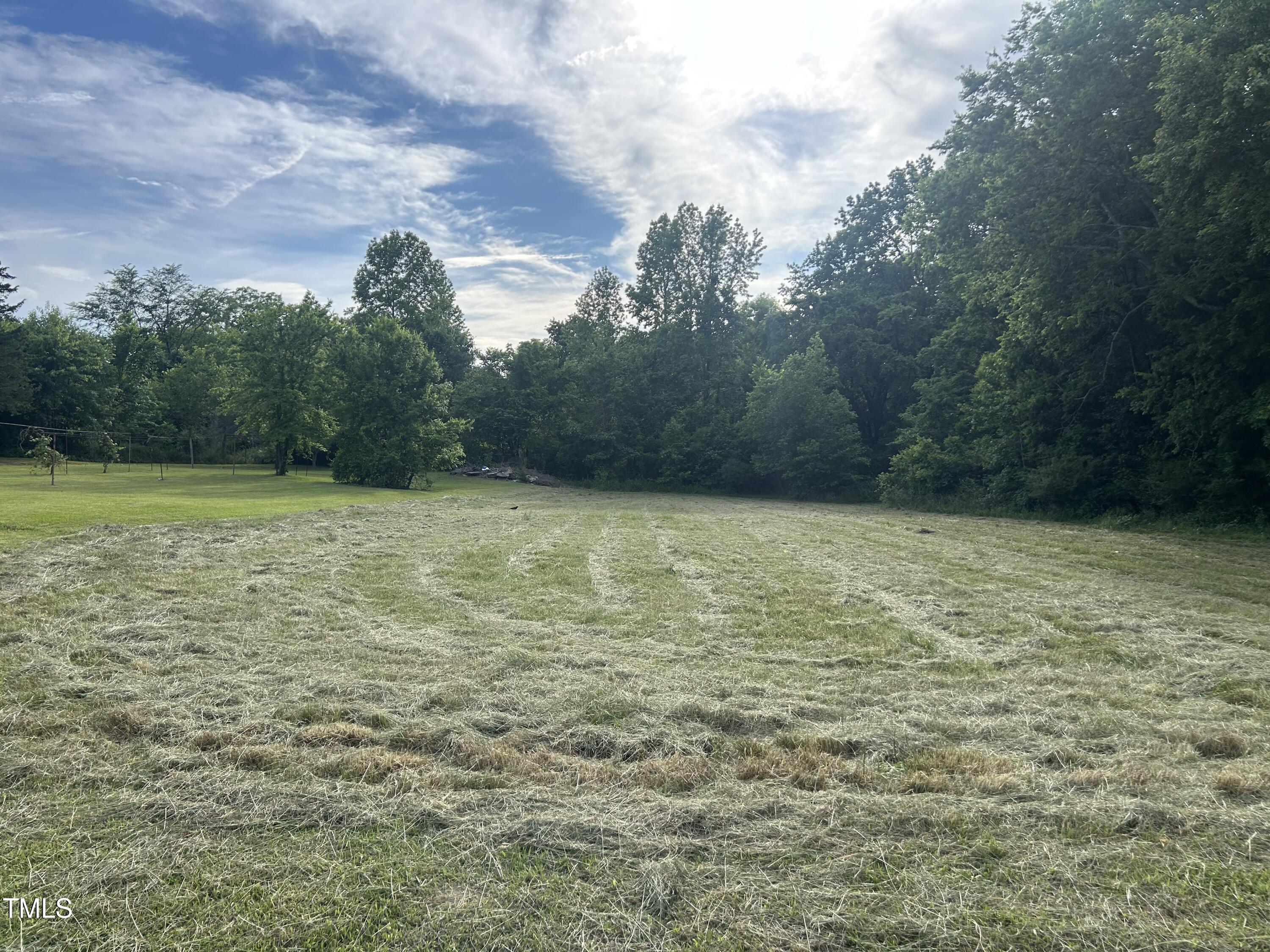 45 Perkinson Street Kittrell, NC 27544 - Photo 7 of 18 a view of a field with an outdoor space
