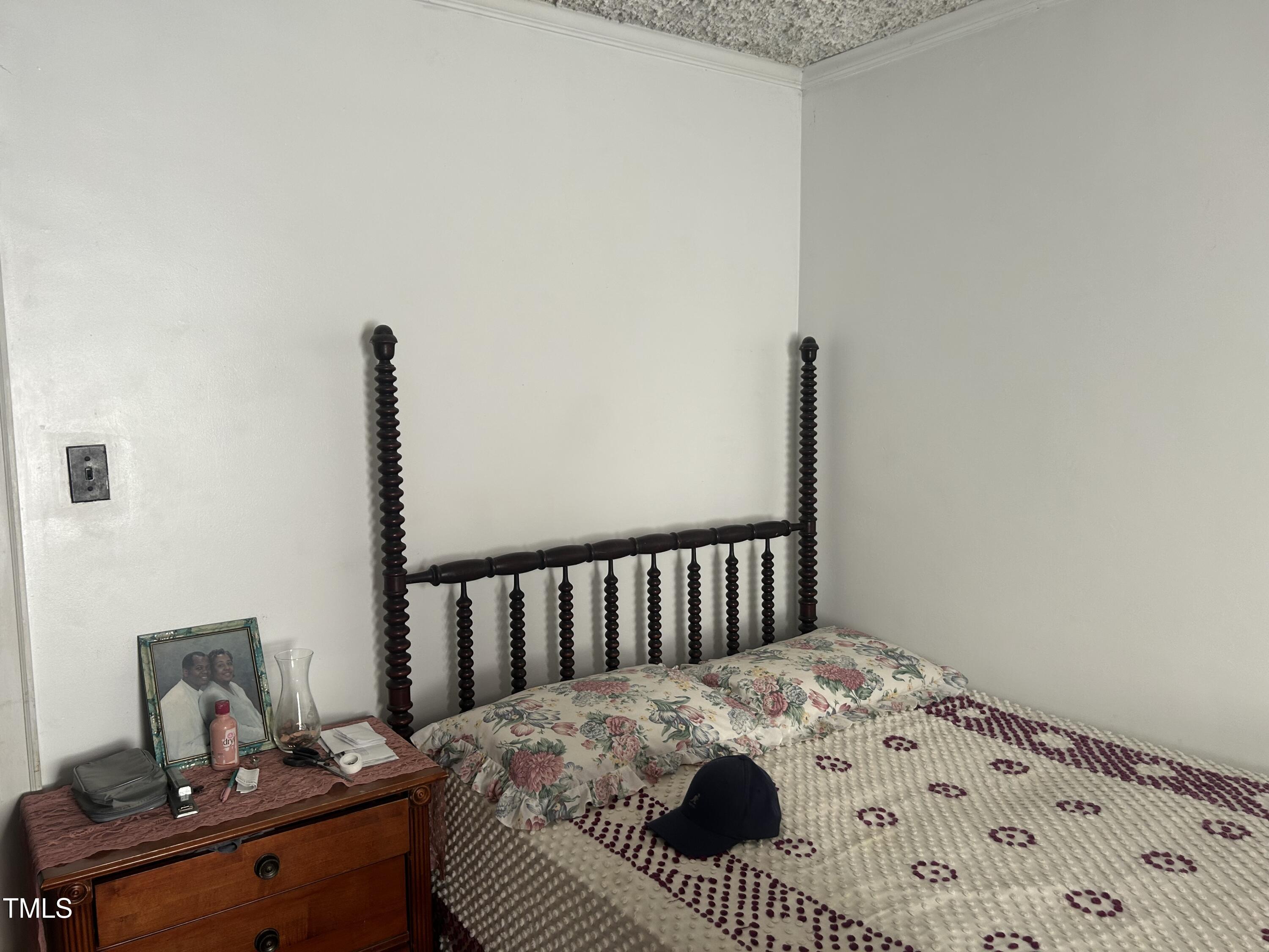 45 Perkinson Street Kittrell, NC 27544 - Photo 8 of 18 a bedroom with a bed and a table in it