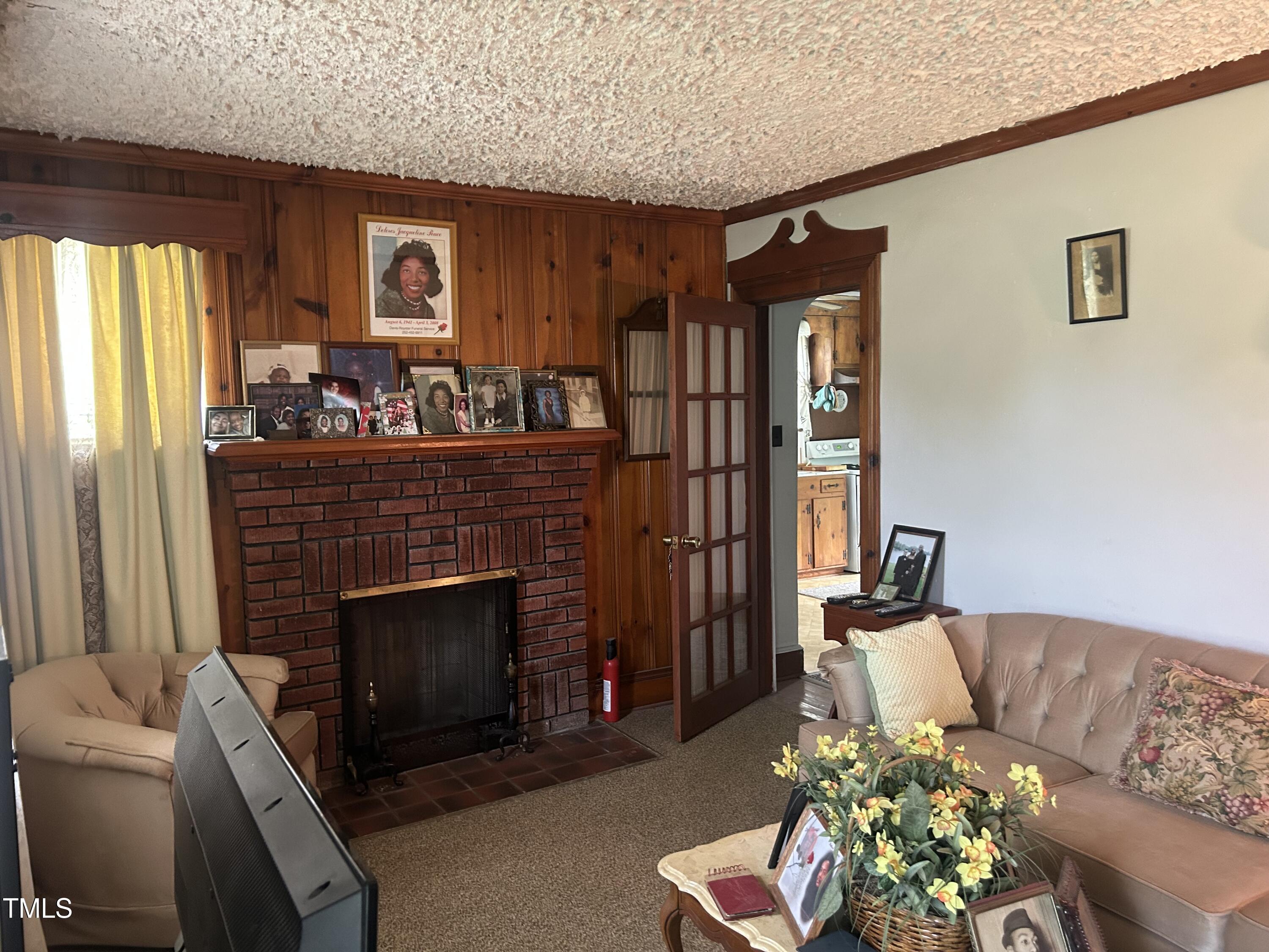 45 Perkinson Street Kittrell, NC 27544 - Photo 9 of 18 a living room with furniture and a fireplace