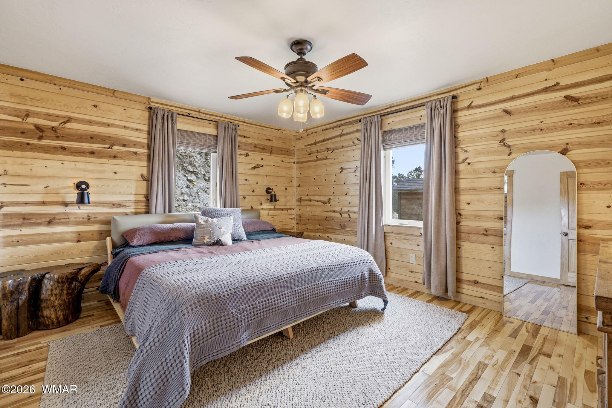 11-15 Co Road Nutrioso, AZ 85932 - Photo 22 of 47 a bedroom with a large bed and a chandelier