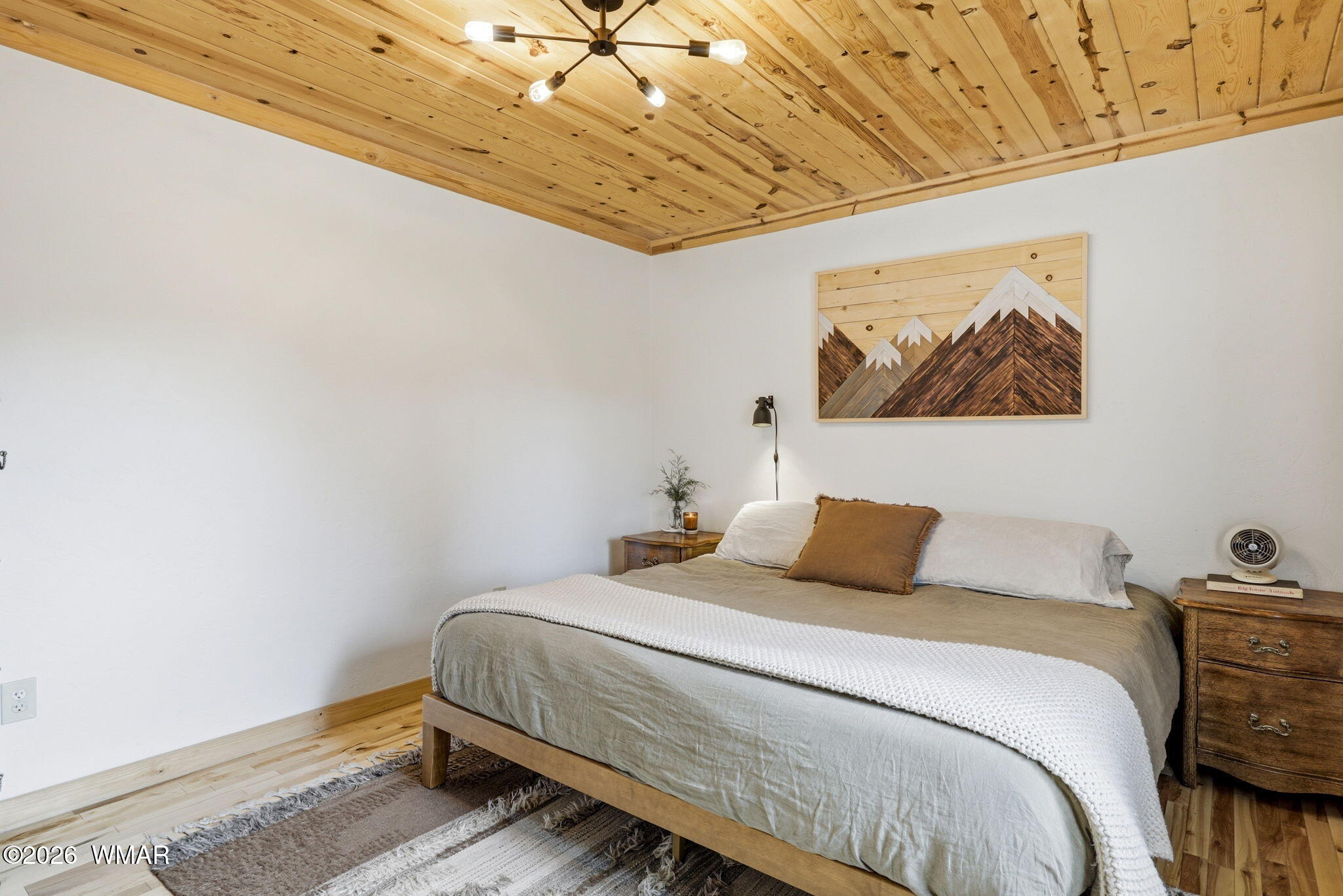 11-15 Co Road Nutrioso, AZ 85932 - Photo 28 of 47 a bedroom with a bed and a painting on the wall