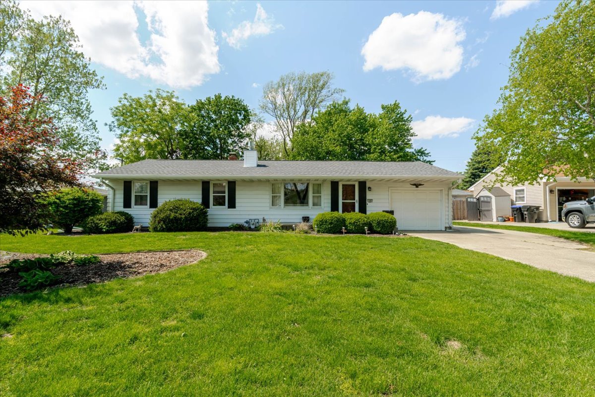 302 Radliff Road Bloomington, IL 61701 - Photo 1 of 35 a front view of a house with a garden