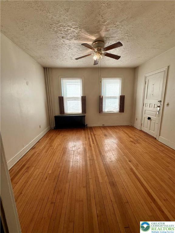 326 West Broad Street, Unit 1 Bethlehem, PA 18018 - Photo 2 of 9 wooden floor in an empty room with a window