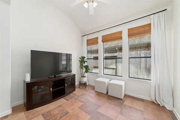 a living room with furniture fireplace and flat screen tv