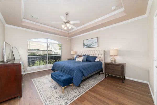 a large bathroom with a granite countertop double vanity sink a mirror and a bathtub