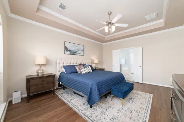 a spacious bathroom with a granite countertop sink a mirror and a