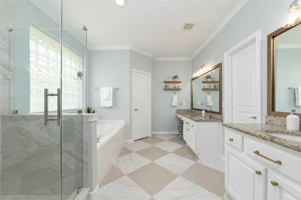 a bathroom with a bathtub and a shower