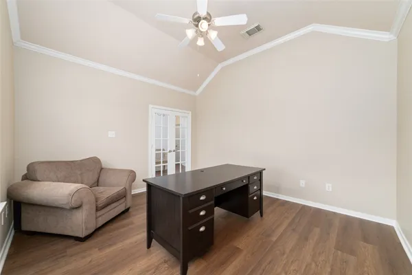a spacious bedroom with a bed and a window