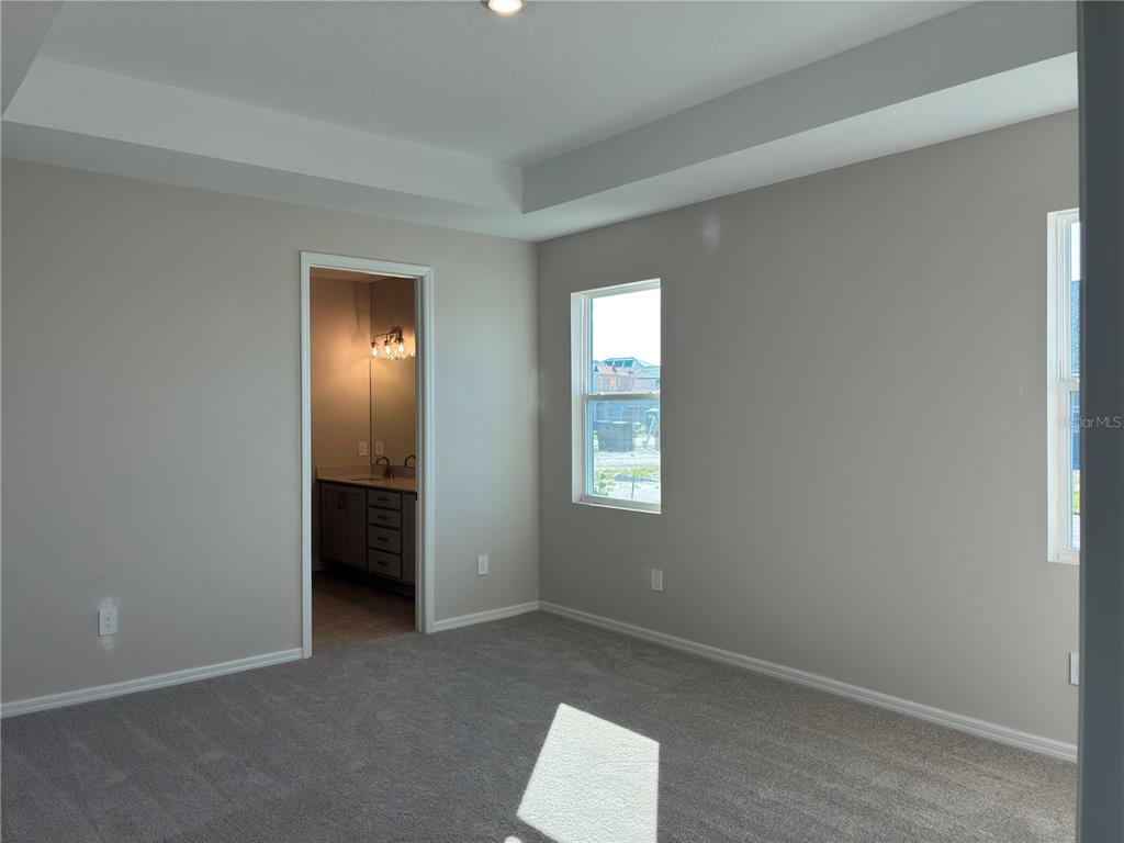 10029 Hidden Hammock Loop Parrish, FL 34221 - Photo 11 of 14 an empty room with windows and closet