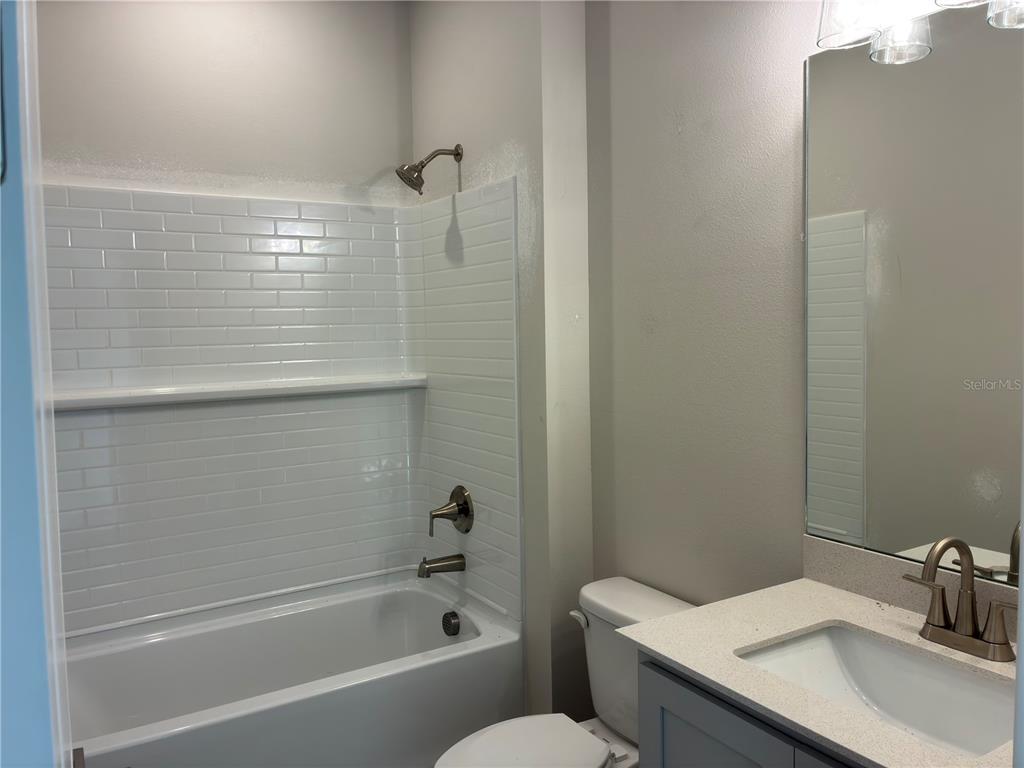 10029 Hidden Hammock Loop Parrish, FL 34221 - Photo 6 of 14 a bathroom with a sink and a bathtub