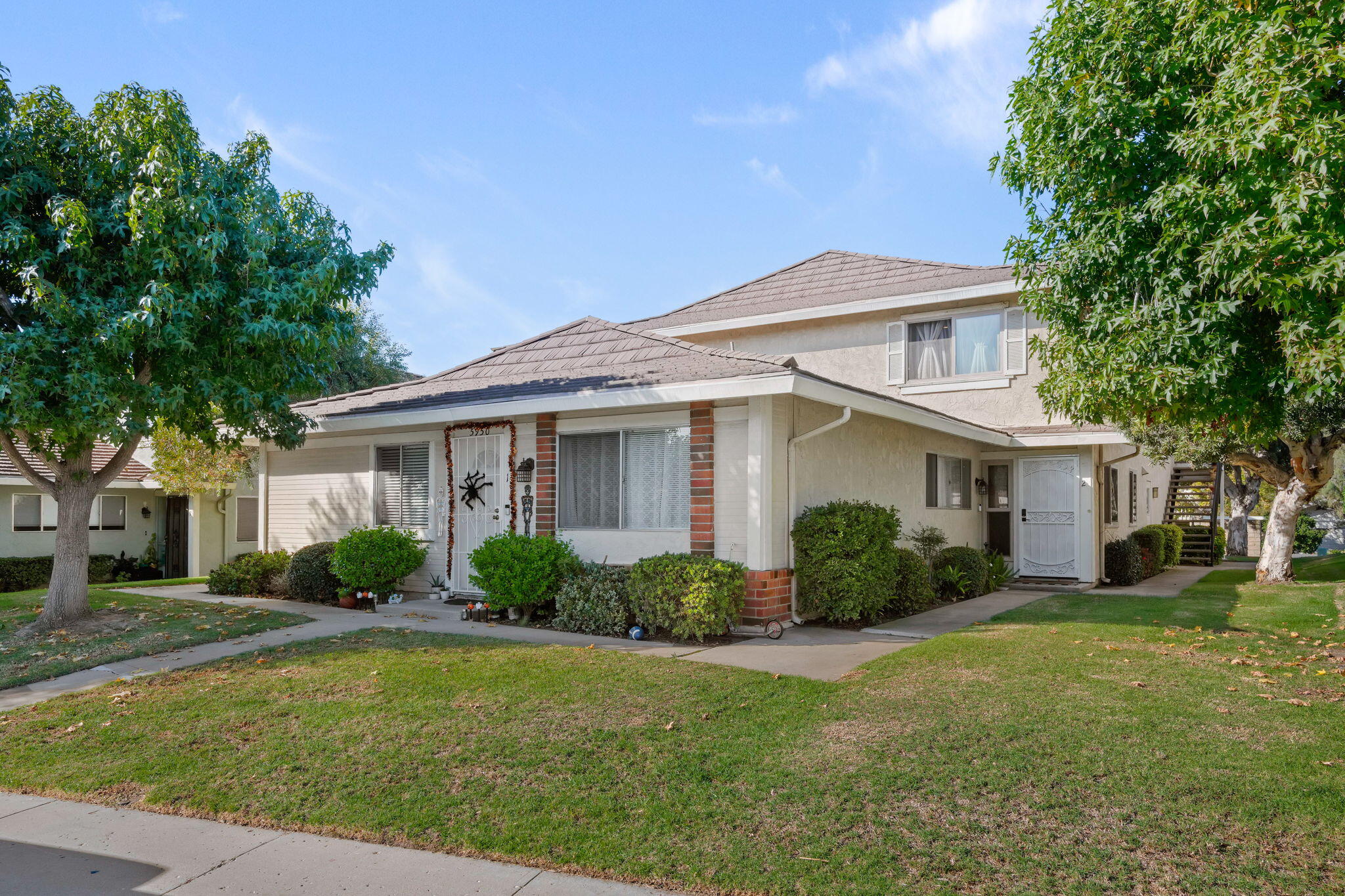 a front view of a house with garden
