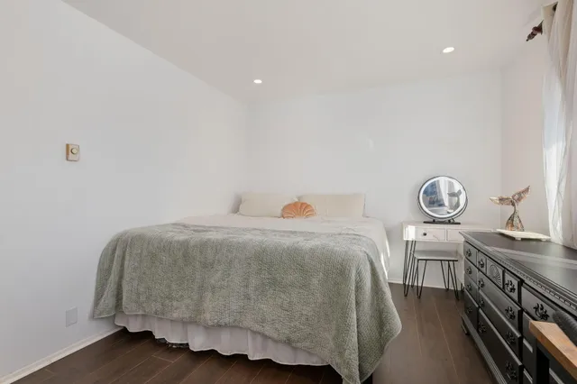 a bedroom with a bed and a cabinets