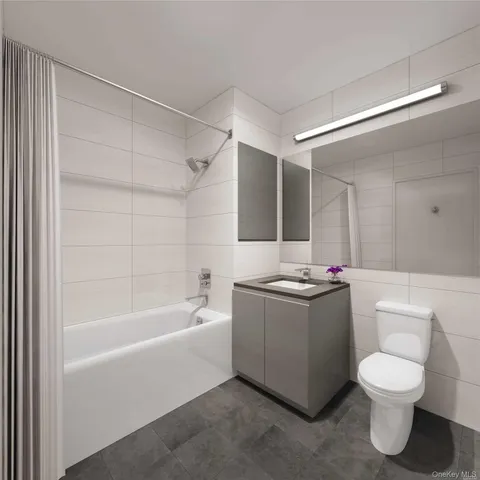 a bathroom with a sink a toilet and bathtub