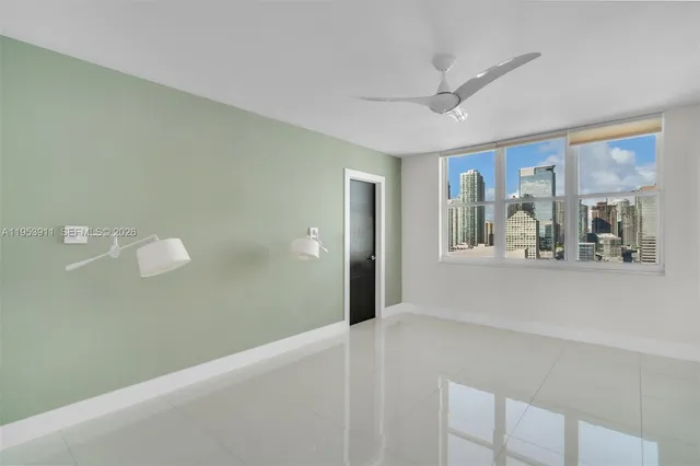 a bathroom with a granite countertop sink a toilet a mirror and shower