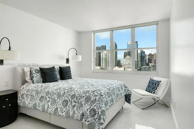 a bathroom with a granite countertop shower a toilet and a sink
