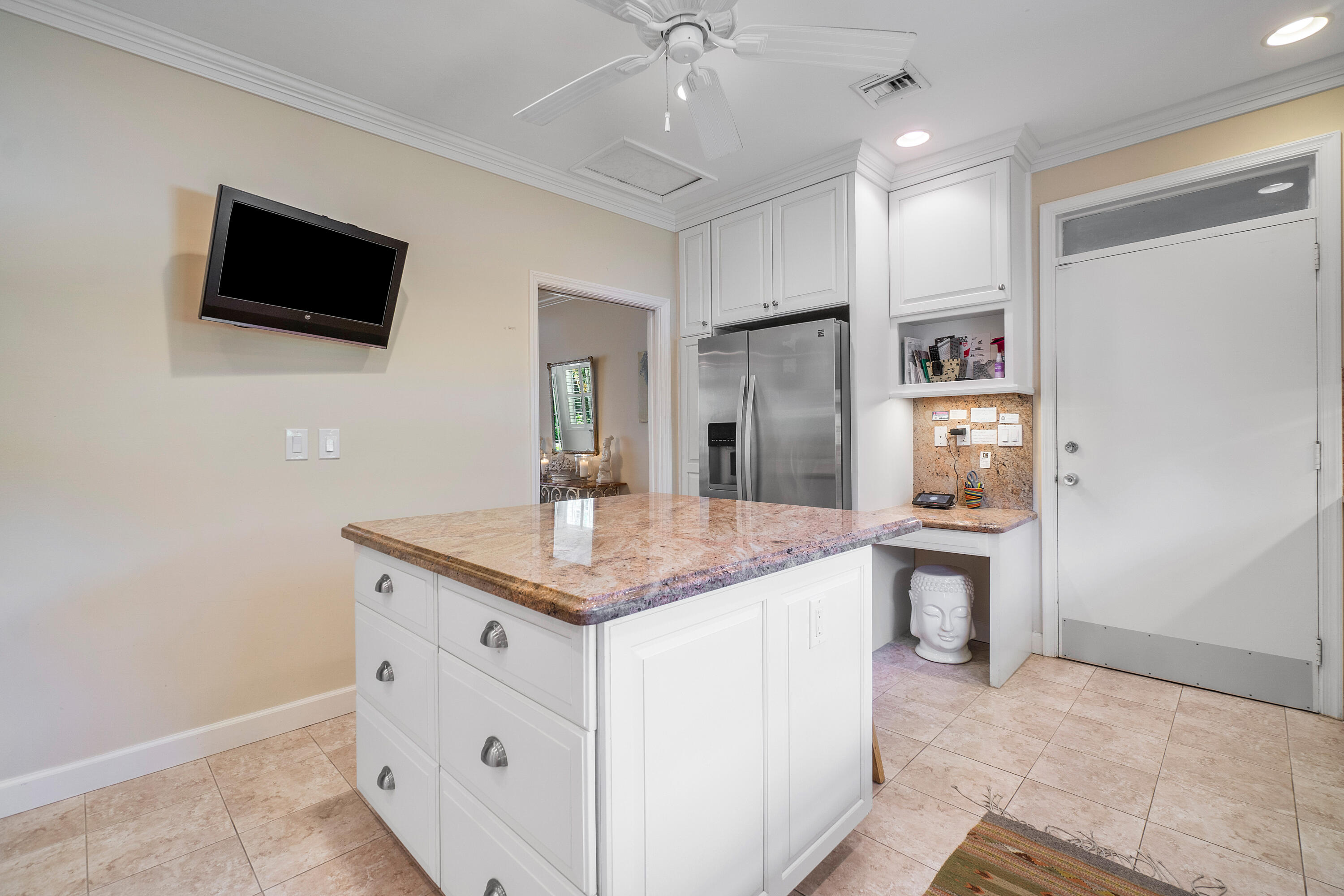 230 Plantation Road Palm Beach, FL 33480 - Photo 12 of 30 a kitchen with stainless steel appliances granite countertop a sink and a refrigerator