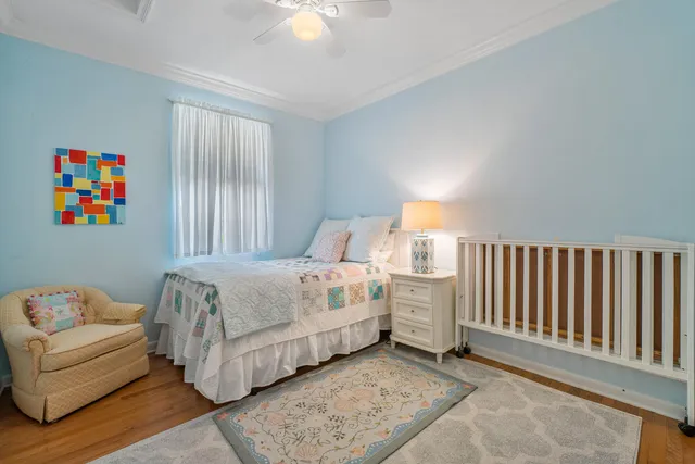 a spacious bedroom with a bed and a couch