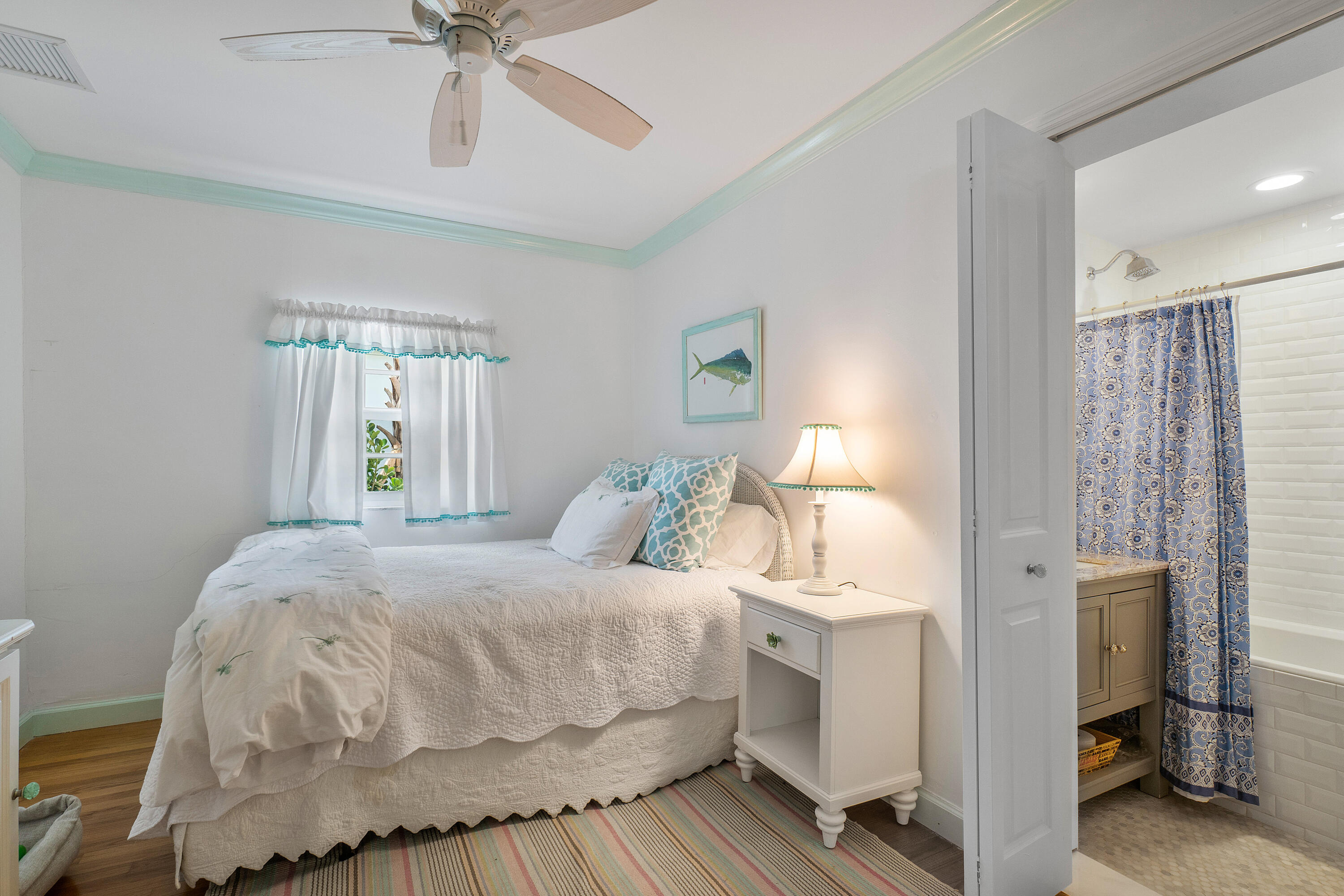 230 Plantation Road Palm Beach, FL 33480 - Photo 27 of 30 a bedroom with a bed and a chandelier