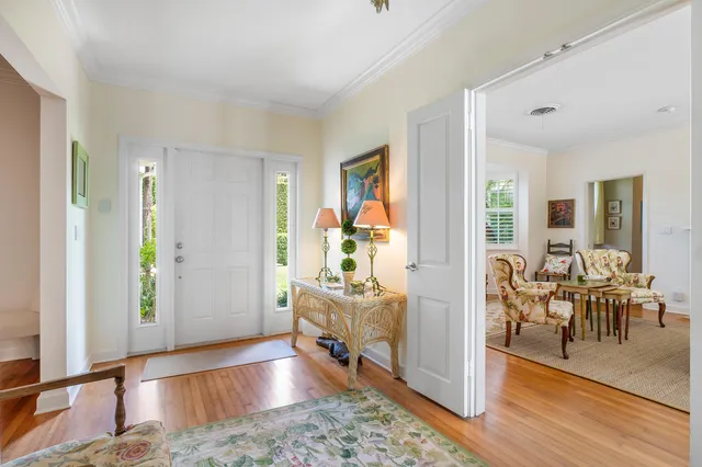 a view of a livingroom with furniture and hardwood floor