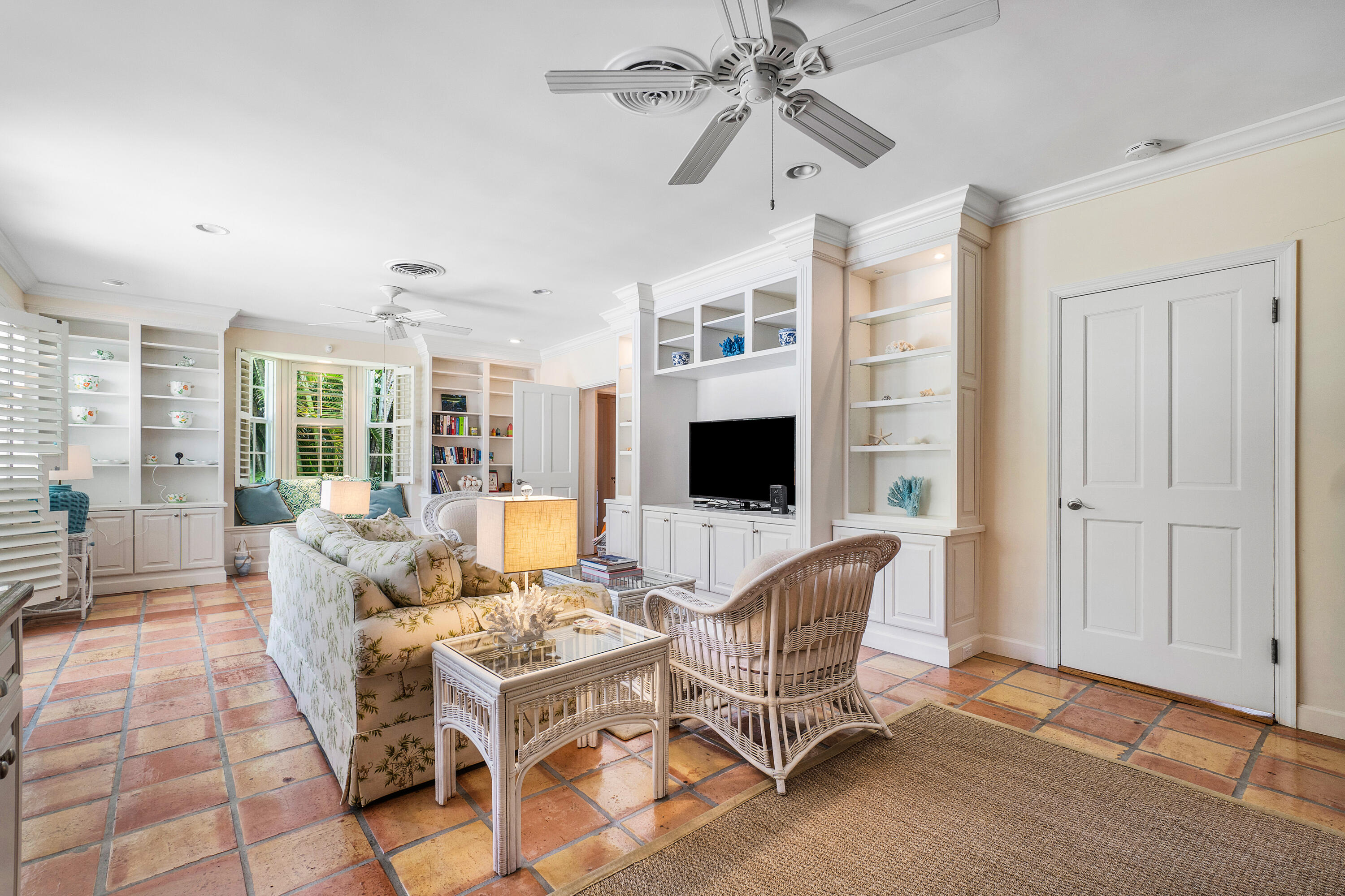 230 Plantation Road Palm Beach, FL 33480 - Photo 10 of 30 a living room with furniture a flat screen tv and a floor to ceiling window