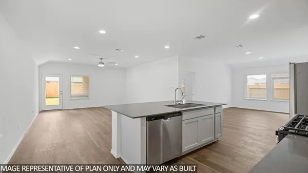 a kitchen with a sink and window