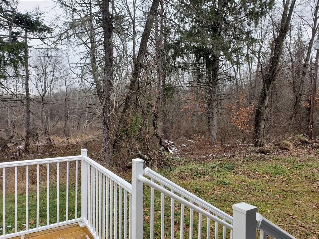 548 New Castle Road Slippery Rock, PA 16057 - Photo 8 of 36 a view of a wooden fence and trees