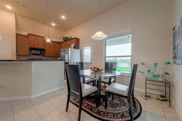 a dining room with furniture and window