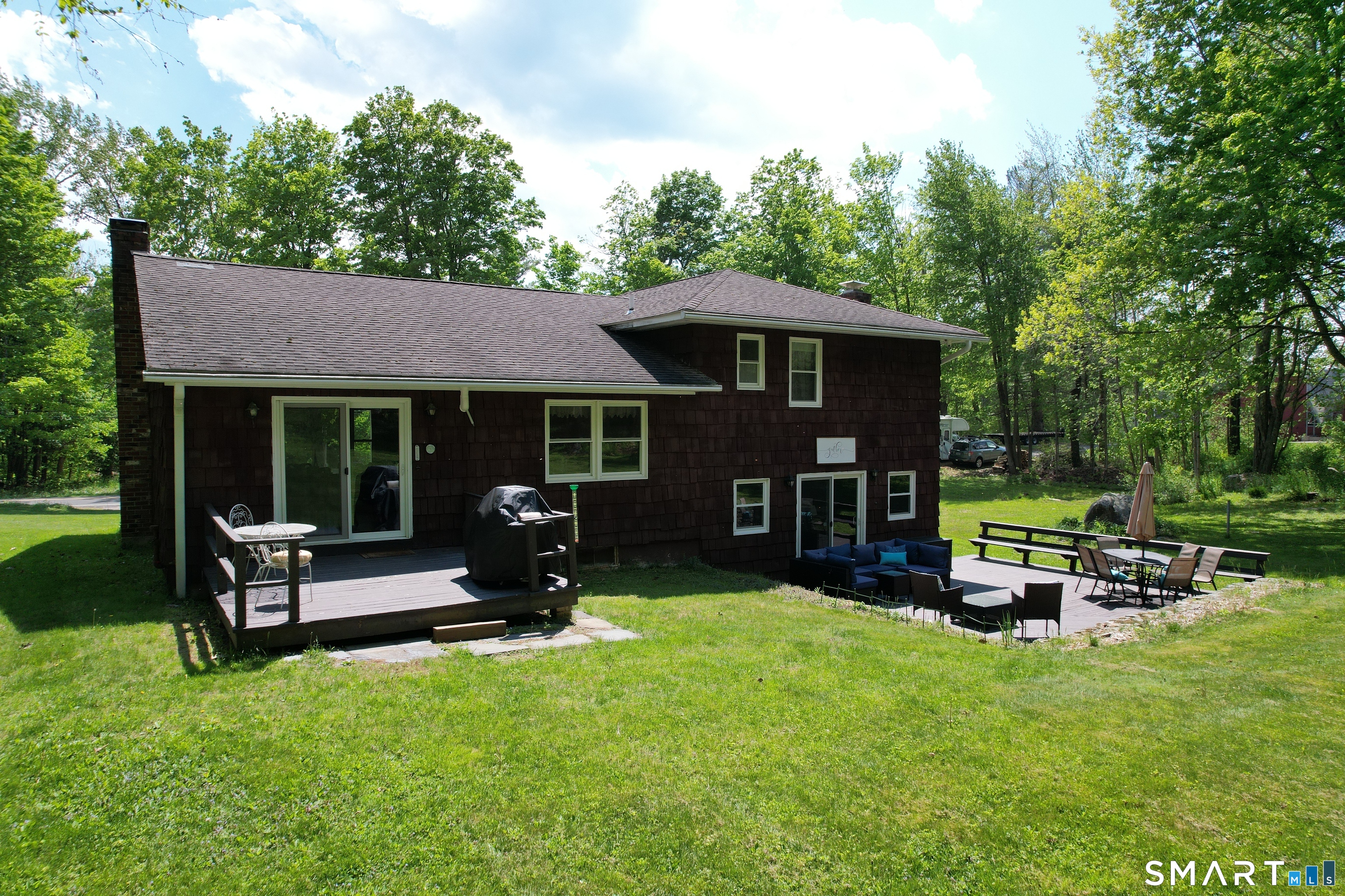 17 Colebrook Road Norfolk, CT 06058 - Photo 5 of 21 a view of a house with backyard porch and sitting area