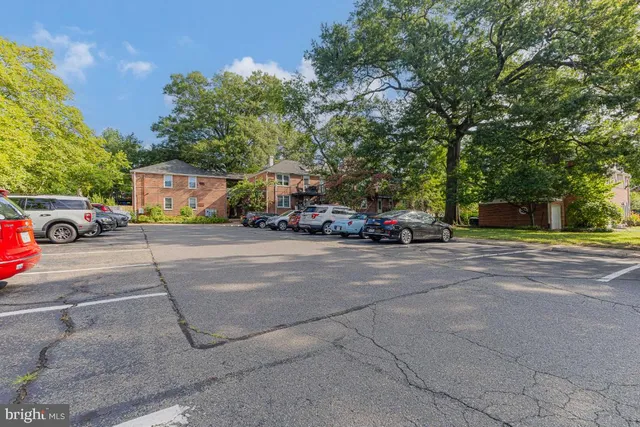 a view of street with parked cars