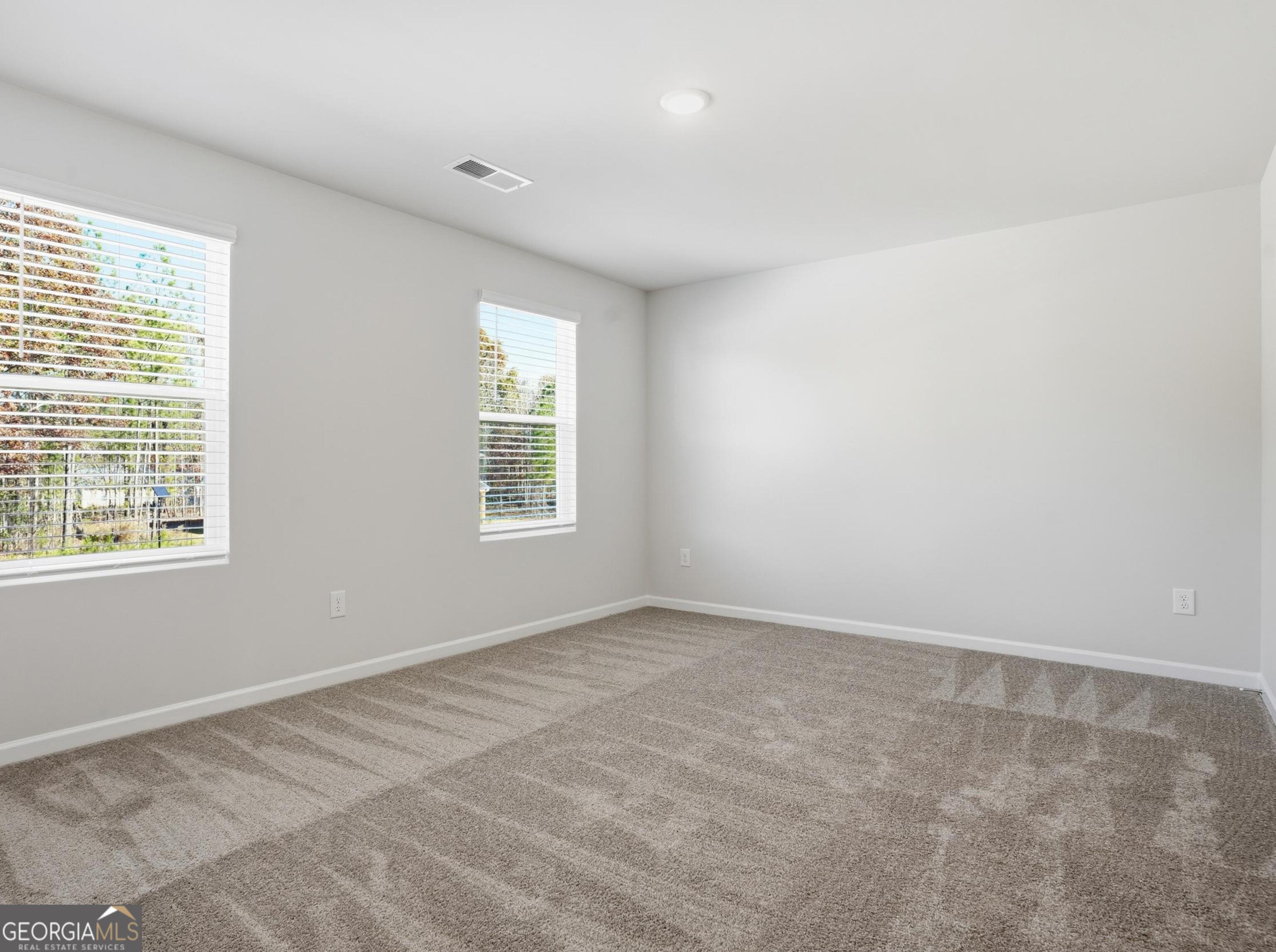 130 Post Oak Drive, Unit 130 Jackson, GA 30233 - Photo 21 of 29 an empty room with windows