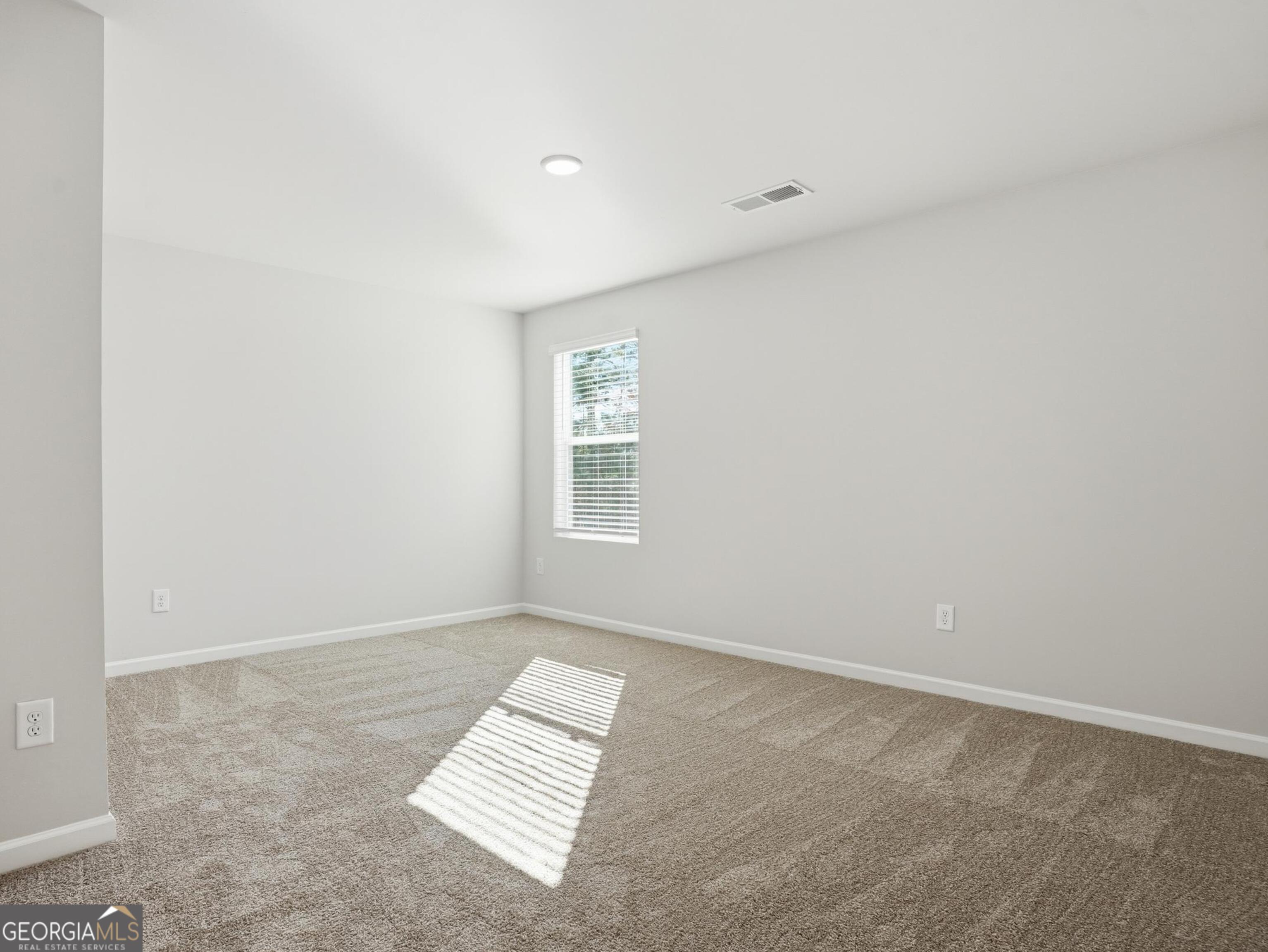 130 Post Oak Drive, Unit 130 Jackson, GA 30233 - Photo 25 of 29 an empty room with a window