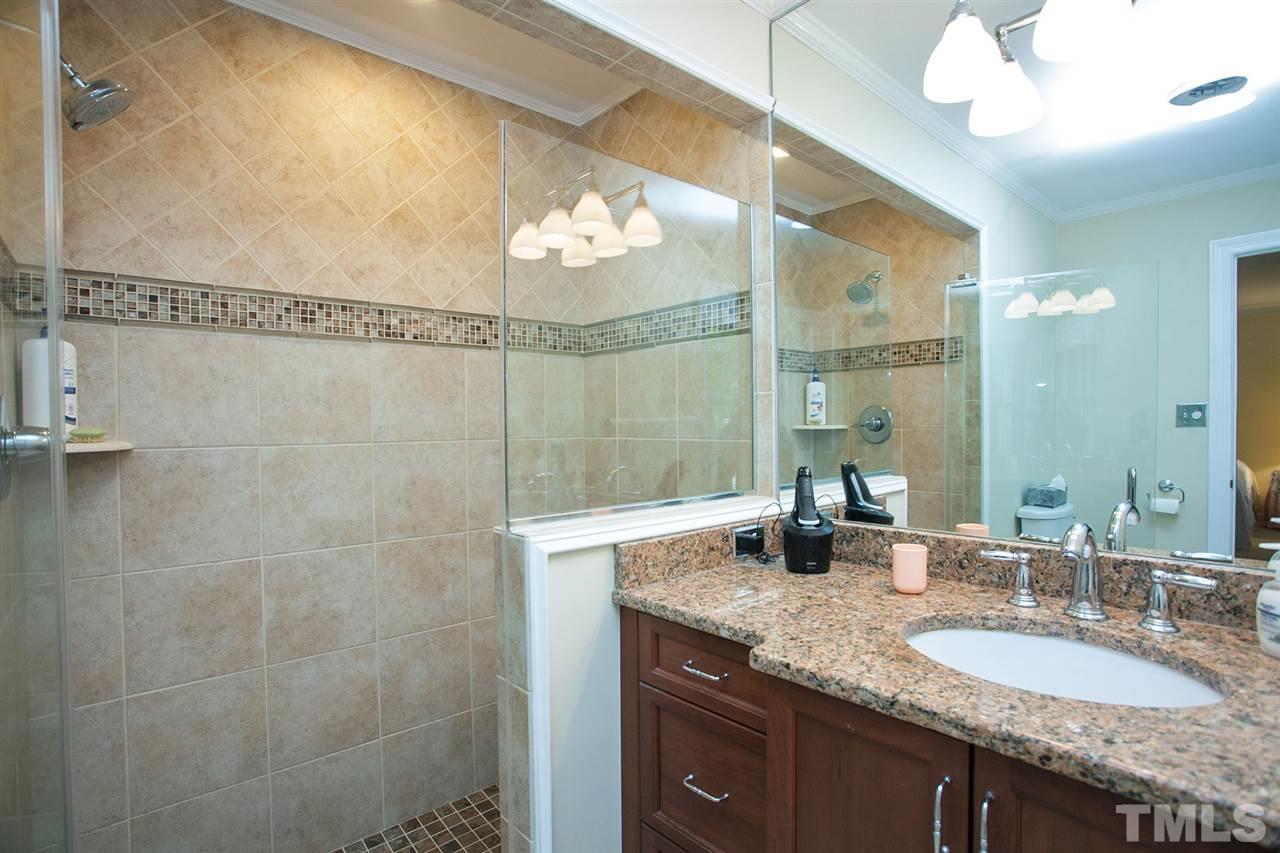903 Queensferry Road Cary, NC 27511 - Photo 16 of 25 New oversized walk-in shower, new cabinetry.
