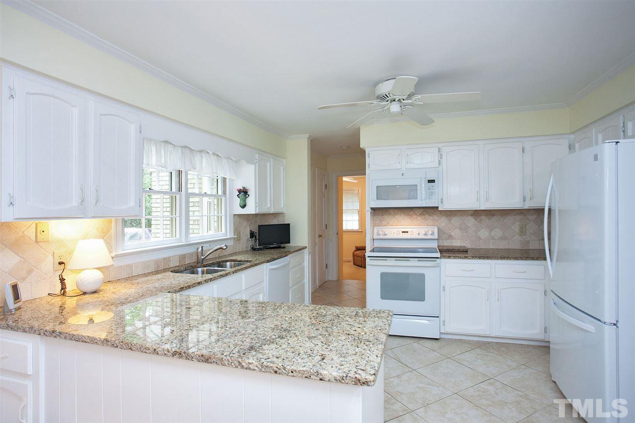 903 Queensferry Road Cary, NC 27511 - Photo 8 of 25 Updated cabinets, appliances, granite countertops.