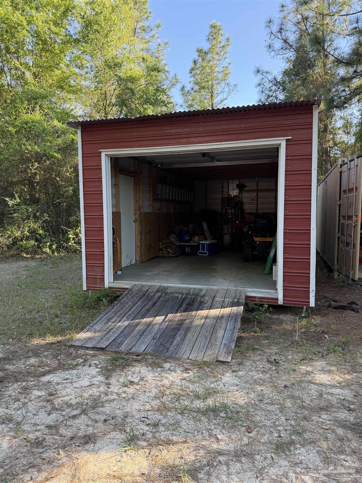 0 Whitfield Road Milton, FL 32570 - Photo 18 of 20 a view of backyard with wooden fence and large trees