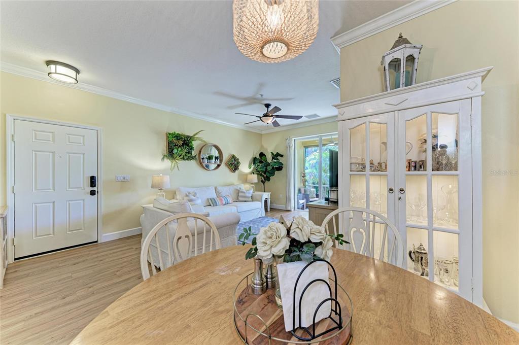 8015 Limestone Lane, Unit 15101 Sarasota, FL 34233 - Photo 14 of 46 a very nice looking room with wooden floor